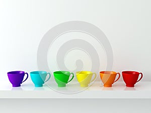 Rainbow cups on the shelf.