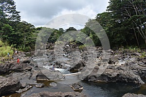 Rainbow Falls in Hilo Hawaii cascading into a peaceful pool