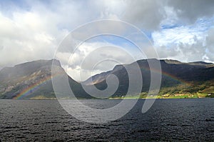 Rainbow in fjord landscape norway