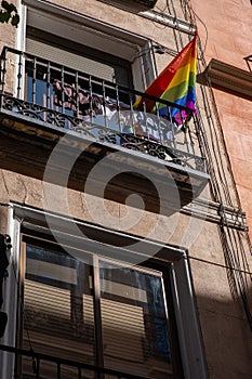 Rainbow flag on the balcony of a house in Madrid, Chueca neighborhood. Lgbt pride photo
