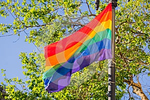 Rainbow flag blowing in the wind, LGBTQ pride month, San Francisco, California