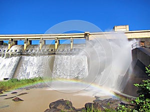 Rainbow in front of a dam wall