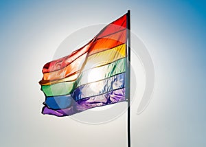 Rainbow Gay Pride Flag on blue sky background, Miami Beach, Florida, USA