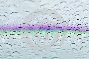 Rainbow on the glass hatch of the car