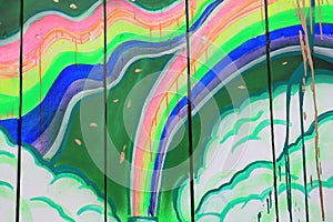 Rainbow Graffiti on Wood Slats with Paint Dripping