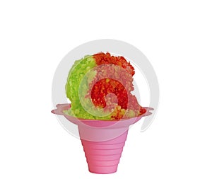 Rainbow Hawaiian Shave ice, Shaved ice or snow cone dessert in a pink flower cup against a white background.