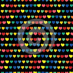 Rainbow hearts hand drawn on a black background. Vector seamless pattern. Blue green orange yellow pink red handmade hearts in a