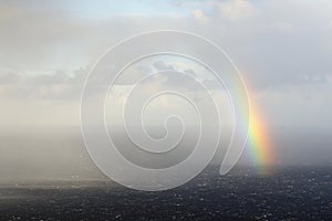 Rainbow in heavy clouds