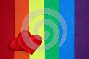Rainbow homosexual color background with red hearts photo