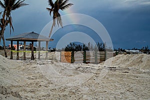 Rainbow hovers in sky over destroyed beach in Marathon Key after Hurricane Irma photo
