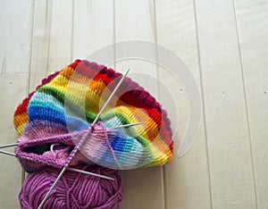 Rainbow knitted hat, handmade. Favorite domestic hobby.