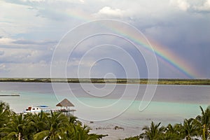 rainbow Laguna de Bacalar Lagoon pier in Quintana roo Mexico