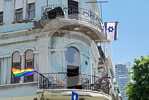 Rainbow LGBT flag and israeli flag on an undefined house in Tel-Aviv