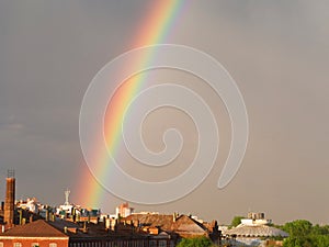 Rainbow multi color image in blue sky rain nature
