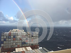 Rainbow in the ocean  from container vessel photo
