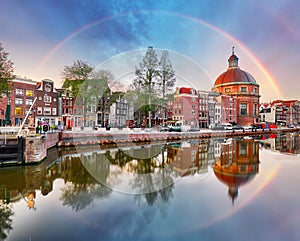 Rainbow over Amsterdam church Koepelkerk, Netherlands