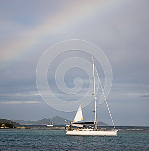 Rainbow over boat in the caribbean