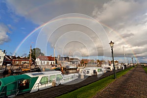 Rainbow over boat at Zoutkamp harbor