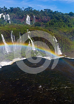 Rainbow over Cataratas del Iguazu waterfall, Brazil photo
