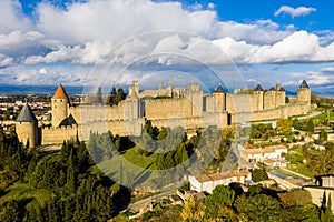 Rainbow over Cite de Carcassonne, a medieval hill-top citadel in the French city of Carcassonne, fortified by two castle walls.