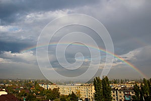 Rainbow over the city after rain