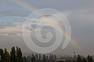 Rainbow over the city after rain