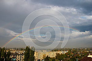 Rainbow over the city after rain