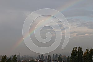 Rainbow over the city after rain