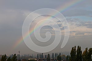 Rainbow over the city after rain