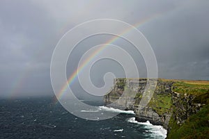 A rainbow over the Cliffs of Moher in Ireland