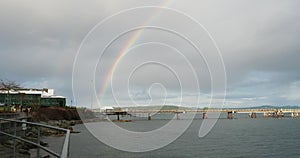 Rainbow over fishing pier