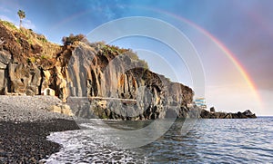 Rainbow over Formosa black beach in Madeira, Portugal