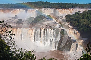 Rainbow over gorgeous waterfalls of Iguazu, Brazil photo