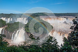 Rainbow over gorgeous waterfalls of Iguazu, Brazil