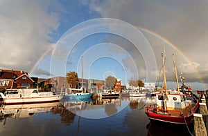 Rainbow over harbor in Zoutkamp