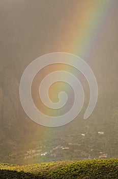 Rainbow over a hill of the Tirajana crater.