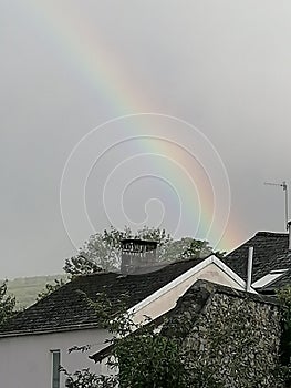 Rainbow over houses