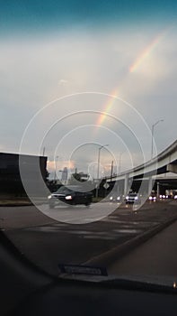 Rainbow over Houston skies in blue field at beltway 8 and westpark