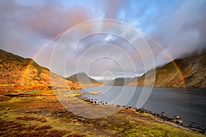 Rainbow Over Lake At Sunset in Lake District, UK.