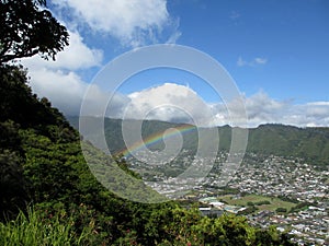 Rainbow over Manoa town on the island of Oahu photo