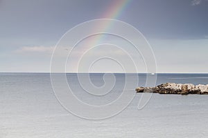 Rainbow over the mediterranean sea