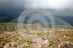Rainbow over mountain valley
