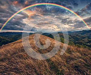 Rainbow over the Mountains. autumn morning in the Carpathians