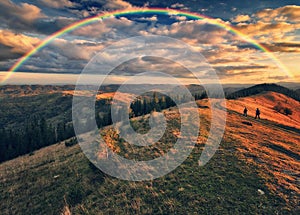 Rainbow over the Mountains. autumn morning in the Carpathians