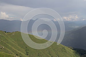 Rainbow over mountains in a sunny day