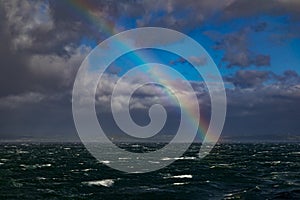 Rainbow Over Rough Seas In The English Channel photo