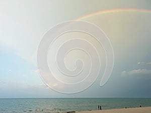 Rainbow over the sea and clear blue sky