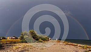 Rainbow over the sea after the rain on the island of Dzharylhach