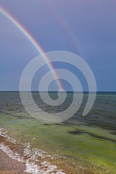 Rainbow over the sea after the rain on the island of Dzharylhach