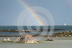 Rainbow over the sea viewed from a beach